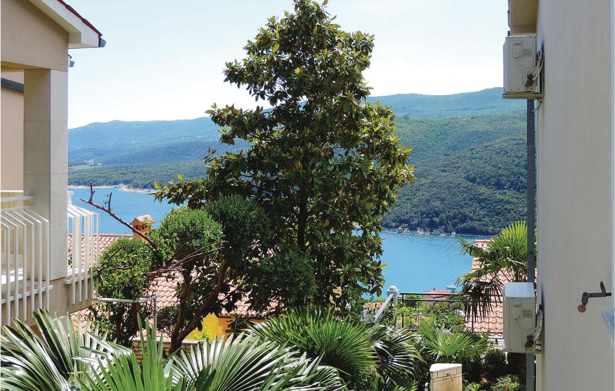 Beautiful Apartment In Rabac With Kitchen Exterior foto